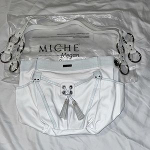 Miche Megan Demi Shell features a snow-white pebbled faux leather.